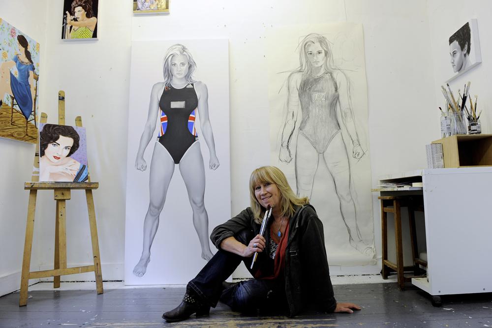 Teresa Witz sitting in front of Olympic 2012 Portraits